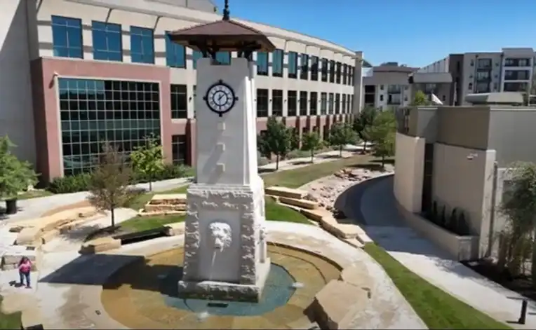 A mineral well fountain and clock tower in Arlington, TX